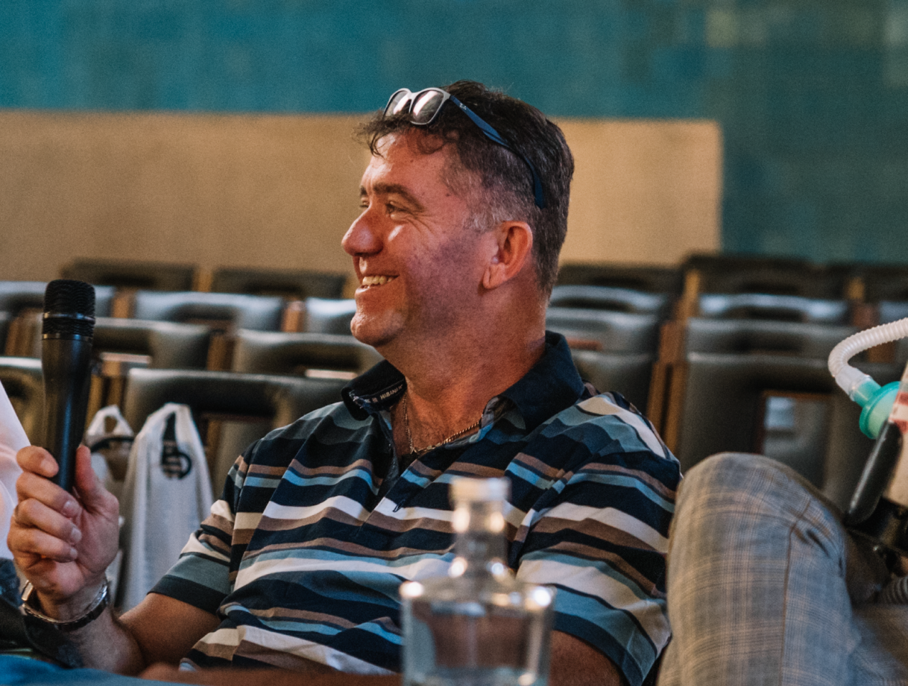 Man with brown hair smiling