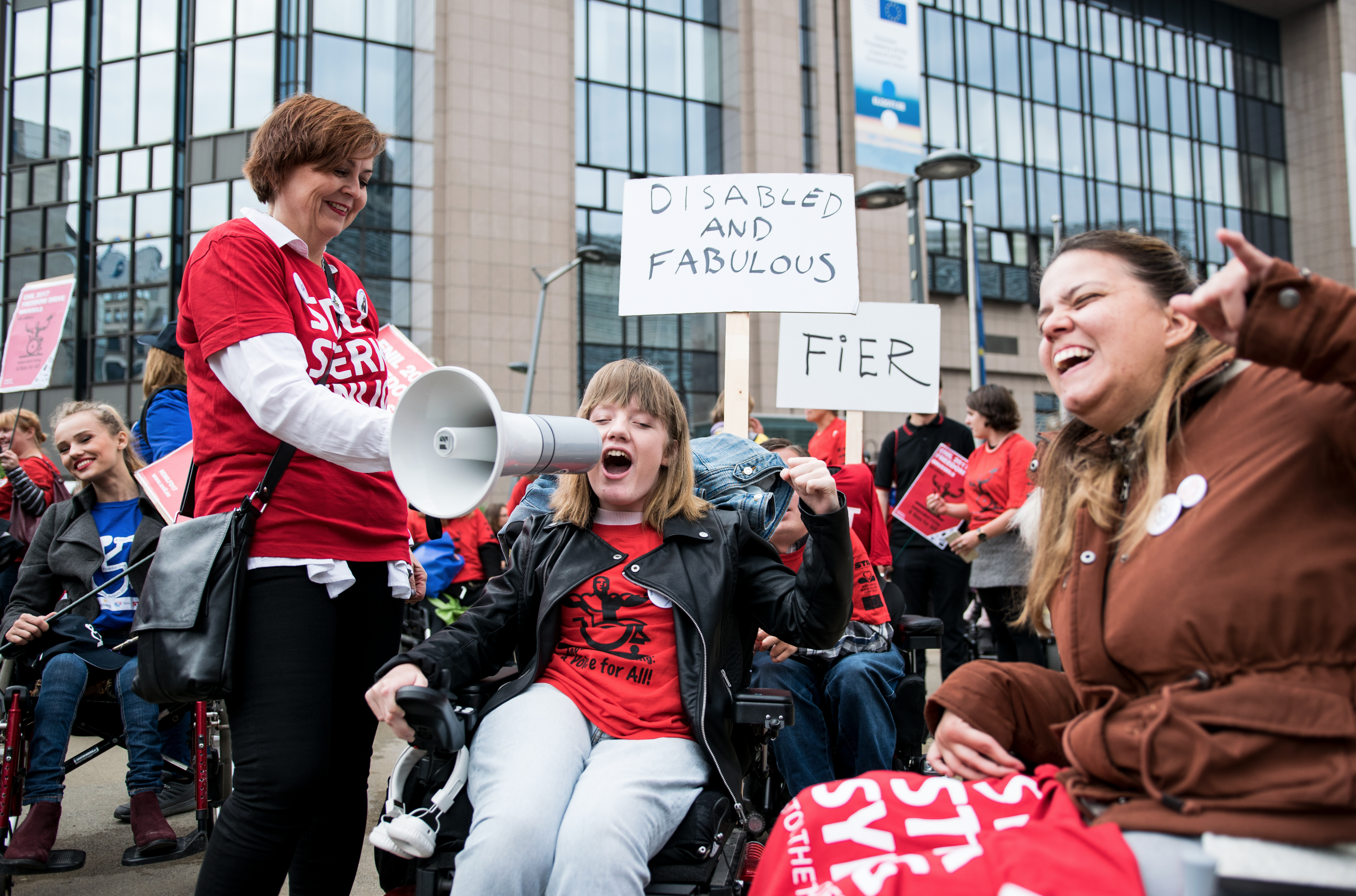 Photo of protesters at the Freedom Drive with one holding a megaphone in which she speaks