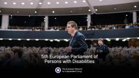 Our Policy Coordinator Florian Sanden is speaking in a room full of people, at the European Parliament. Text says "5th European Parliament of Persons with disabilities" and "European Network on Independent Living"
