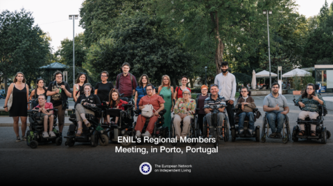 Twenty people are posing for a group photo, in the streets of Porto. Our members are there, together with our staff and some board members.