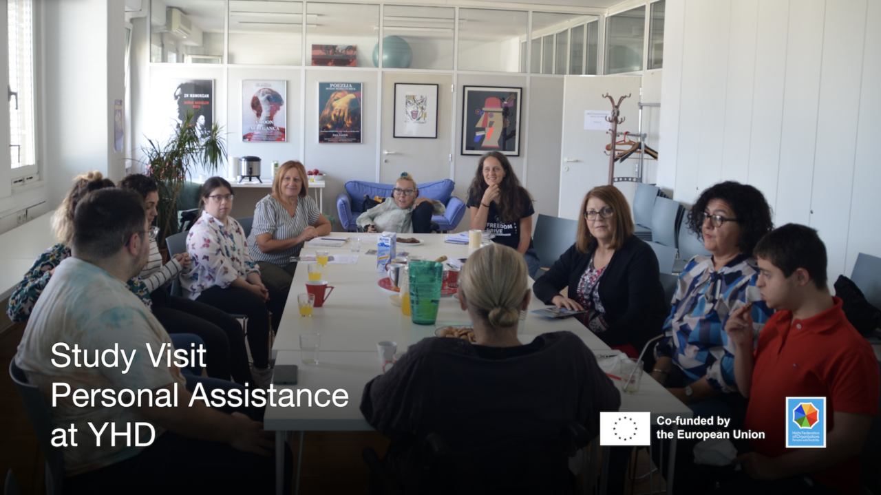 Group of people around a table, discussing. Text says "Study visit. Personal Assistance at YHD"