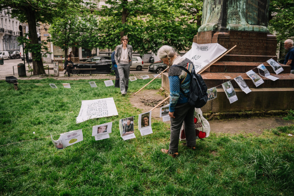 People attaching posters of disabled people and their stories.