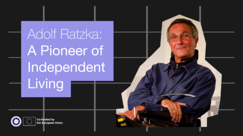 Adolf Ratzka: a pioneer of independent living. IMage of a man with grey hair and glasses smiling. He is a wheelchair user.