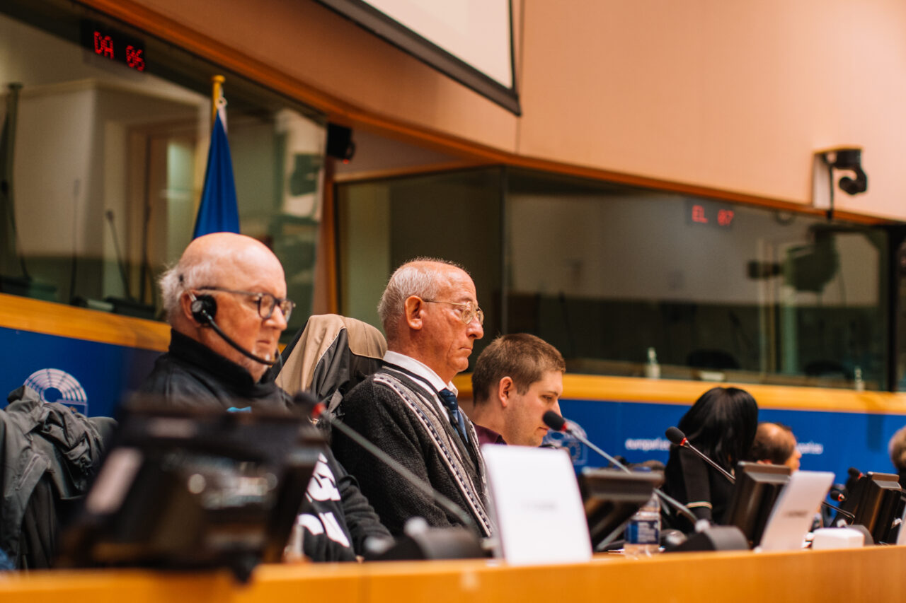 The photo shows Jos Huys as second from the left, behind the podium in the European Parliament, during Freedom Drive 2022