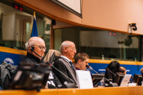 The photo shows Jos Huys as second from the left, behind the podium in the European Parliament, during Freedom Drive 2022