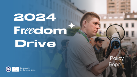 Freedom Drive 2024. Policy Report. Person holding a megaphone