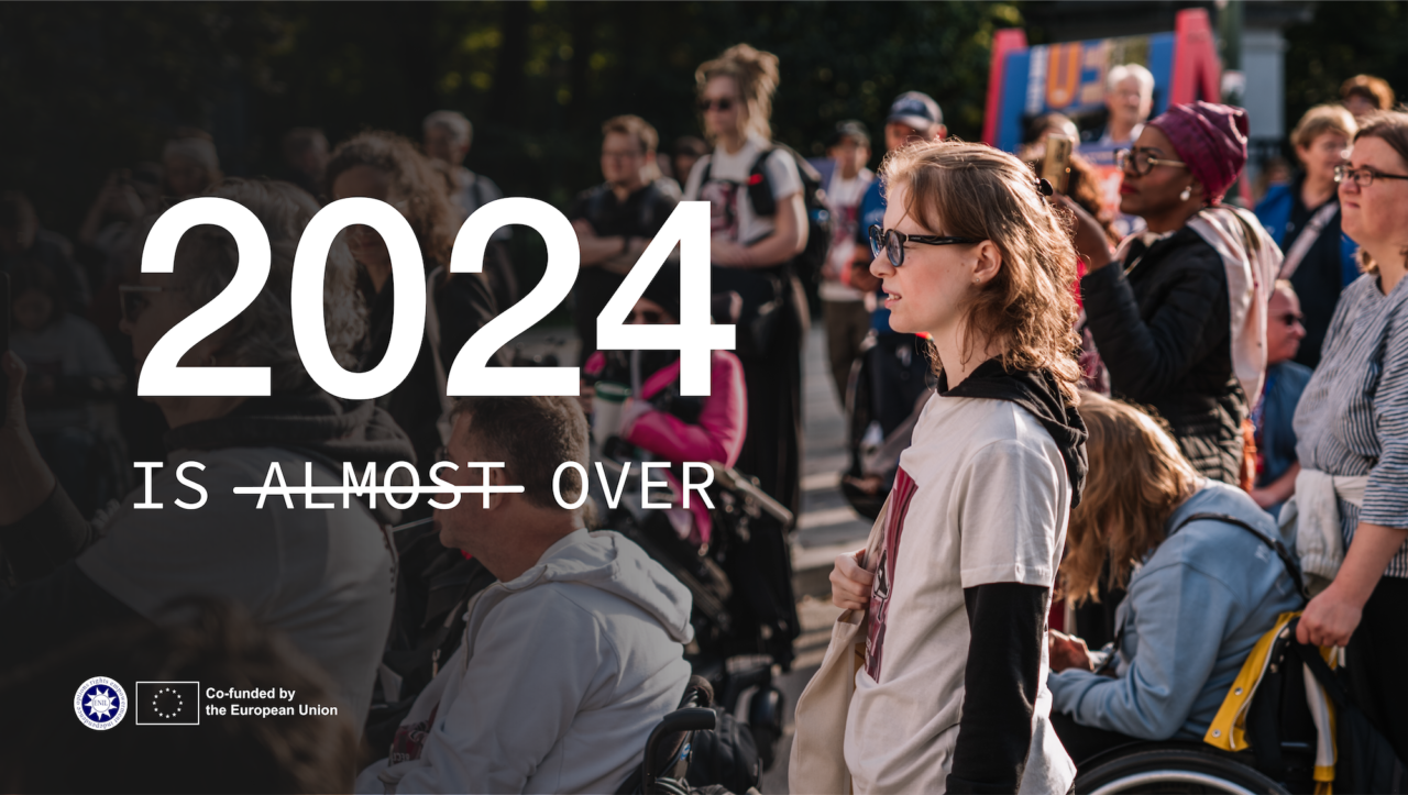 2024 is over. Photo of people watching something. It looks like they're watching the text.