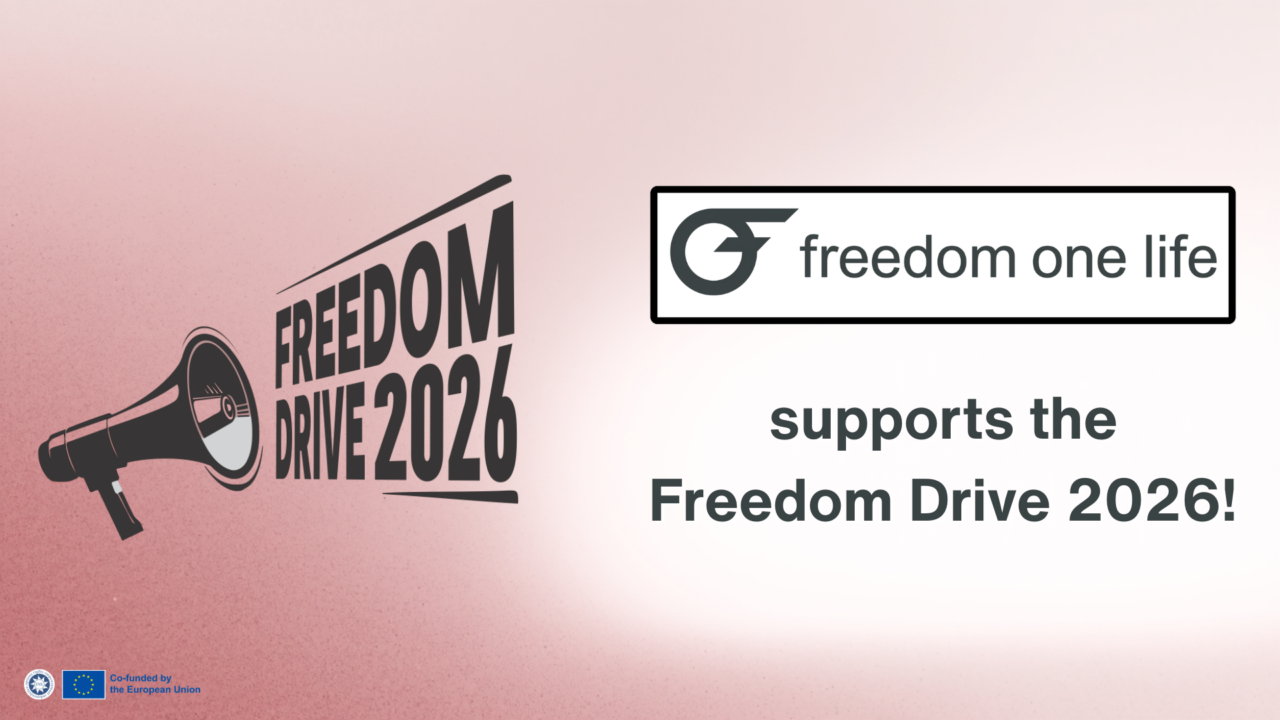 Graphic with a soft pink gradient background. On the left, a black megaphone illustration next to bold text reading “Freedom Drive 2026.” On the right, a white box displays the “freedom one life” logo. Below, grey text reads “supports the Freedom Drive 2026!”
