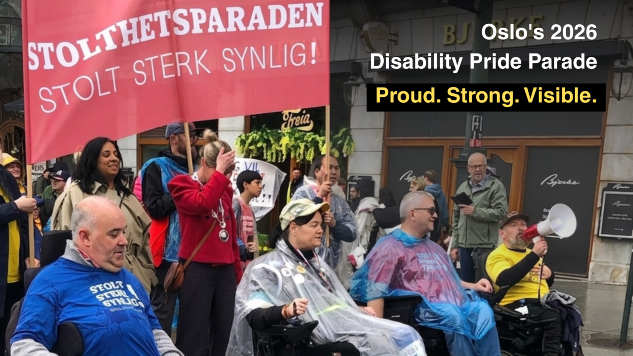 **Alt text:** People taking part in Oslo’s 2026 Disability Pride Parade on a city street. Several wheelchair users and other participants are gathered together, some wearing rain ponchos. A large red banner reads “Stolthetsparaden” and “Stolt Sterk Synlig!” Text over the image says “Oslo’s 2026 Disability Pride Parade.”