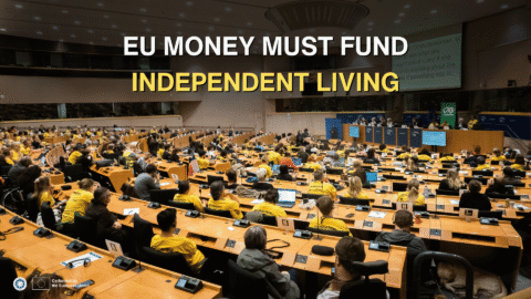 Freedom Drive participants, many wearing yellow T-shirts and some using wheelchairs, fill a European Parliament meeting room, facing a panel of speakers. Overlaid text reads: “EU money must fund Independent Living.” ENIL and EU logos appear at the bottom left alongside “Co-funded by the European Union.”