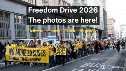 Freedom Drive participants, including wheelchair users and people wearing yellow shirts, march through Brussels behind a yellow banner reading “No more excuses – Our time is now.” Overlaid text reads: “Freedom Drive 2026. The photos are here! Relive the moments. Explore the gallery.” ENIL and EU logos appear at the bottom right with “Co-funded by the European Union.”